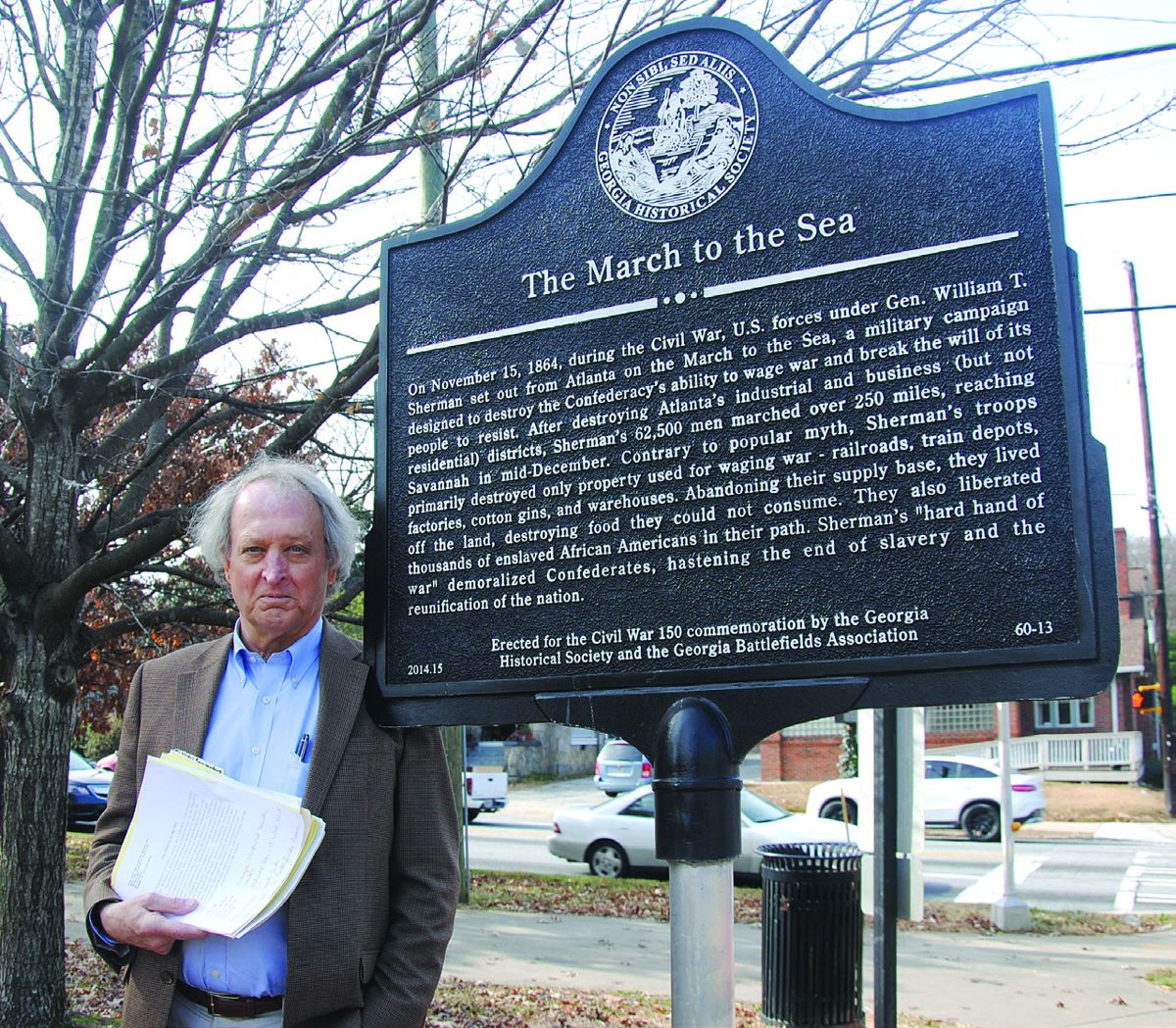 Standing next to the marker is Stephen Davis, author of What the Yankees Did to Us. The marker reads: