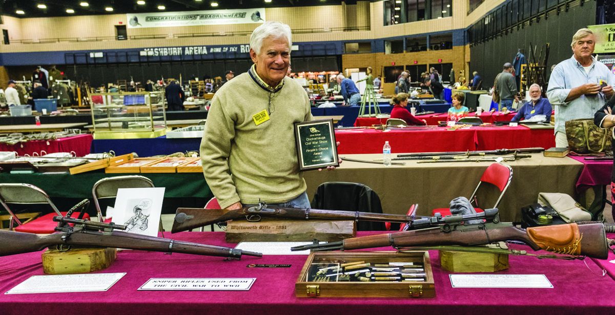 Brian Riel standing proud behind his sharpshooter display with an original Whitworth rifle. He won the People’s Choice Award.