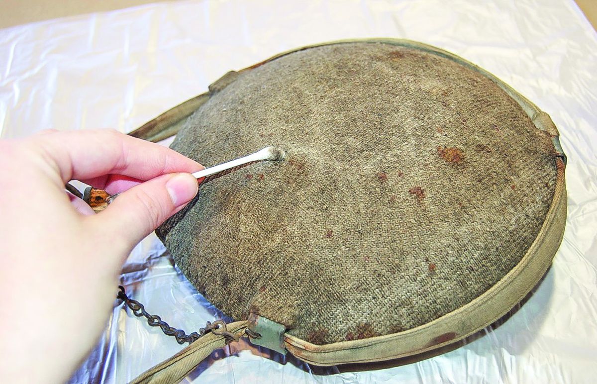 Surface cleaning canteen with cotton swab.