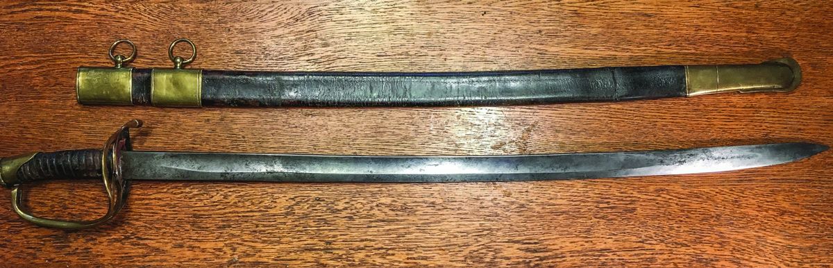 Full view of sword with scabbard. Originally, the middle mount would have been 6 or so inches lower and can easily be slid back into position. It can still be seen where the mount originally sat.