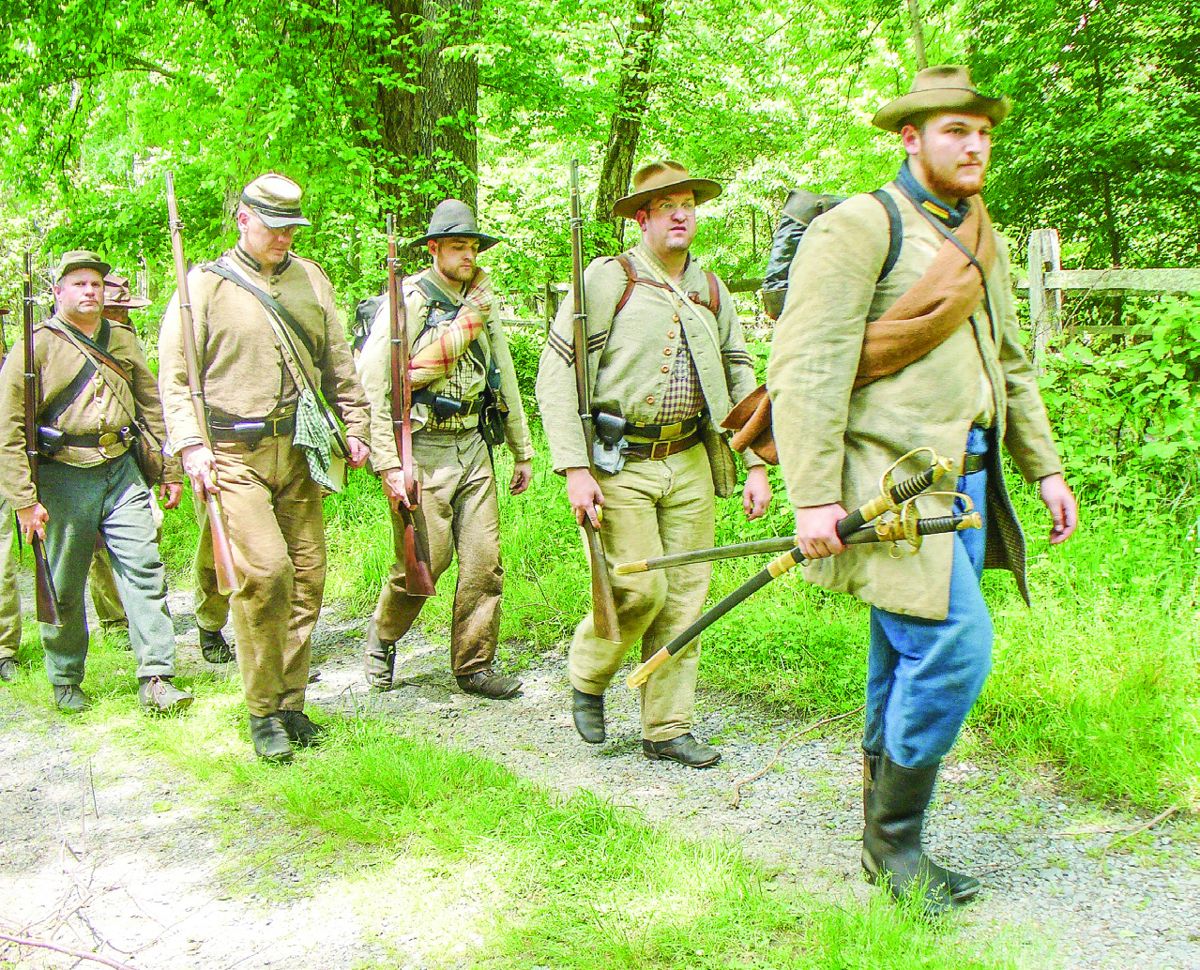 Alex Glisson leads his company of the 5th Alabama back to camp after a night on picket duty.