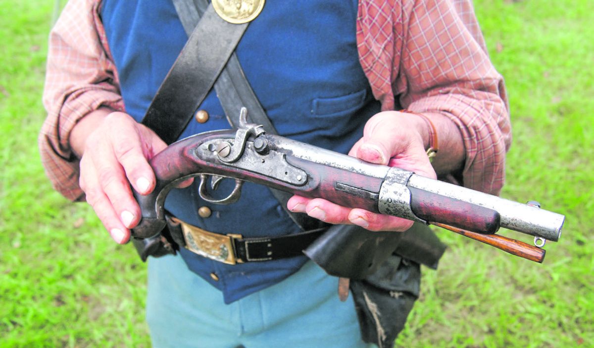 Many different pistols were used during the single-shot demonstration match. Here skirmisher Jim Leinicke prepares to shoot his Model 1819 North flintlock conversion. (Bruce Miller)