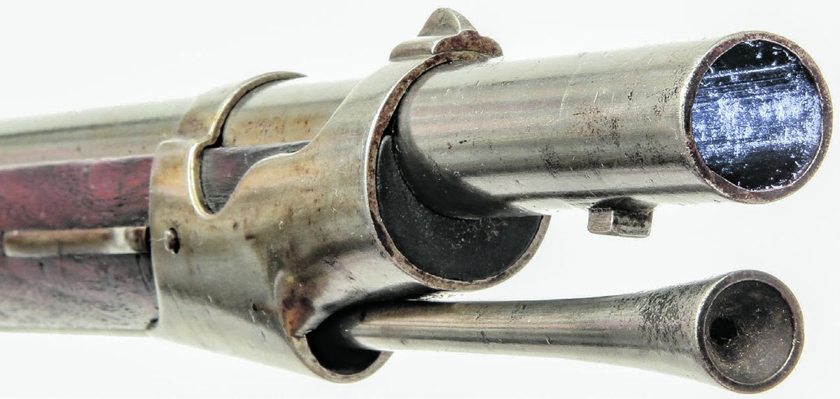 Muzzle area of a rifled & sighted U.S. M1851 Cadet Musket, showing the rifled bore, the new iron front sight and the modified ramrod face.