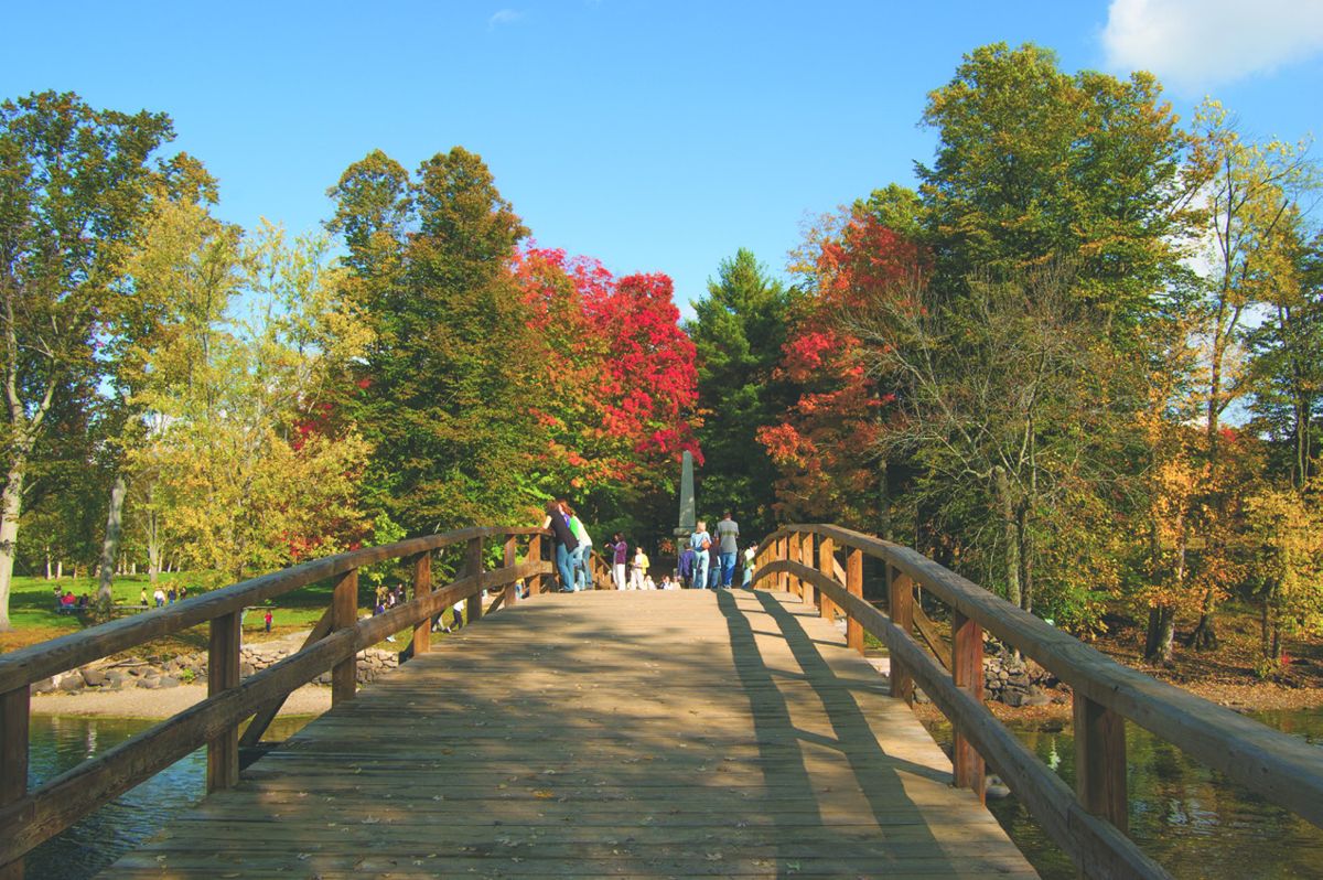 Visitors cross North Bridge over the Concord River at Minute Man National Historical Park in Massachusetts, site of the “shot heard ’round the world” that launched the American War for (Glenn De Cesare)
