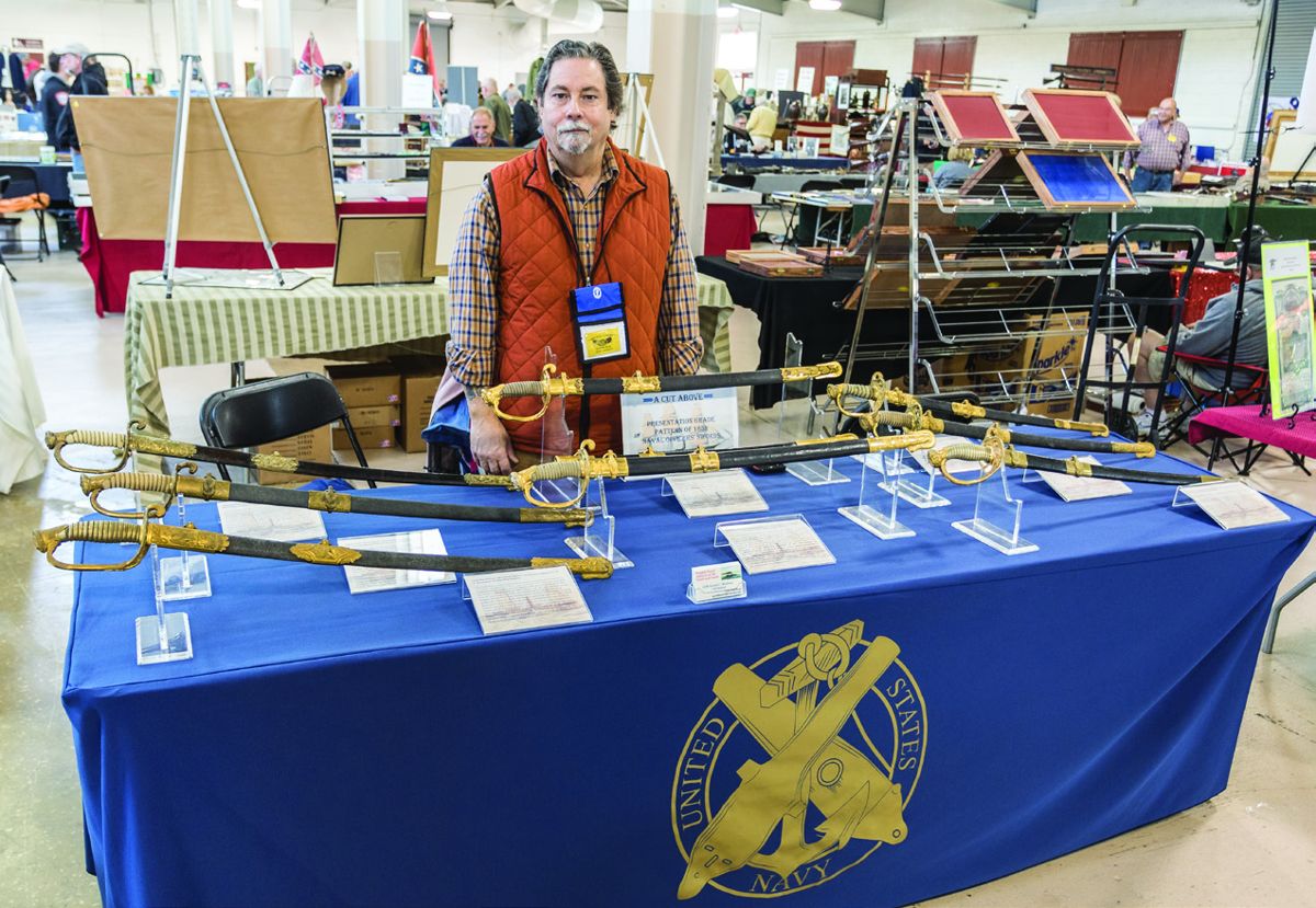 Gerald Roxbury with his display of naval swords.