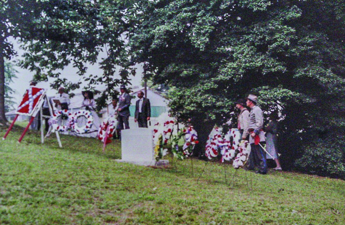 The memorial stone was bedecked with floral tributes to the general’s memory.