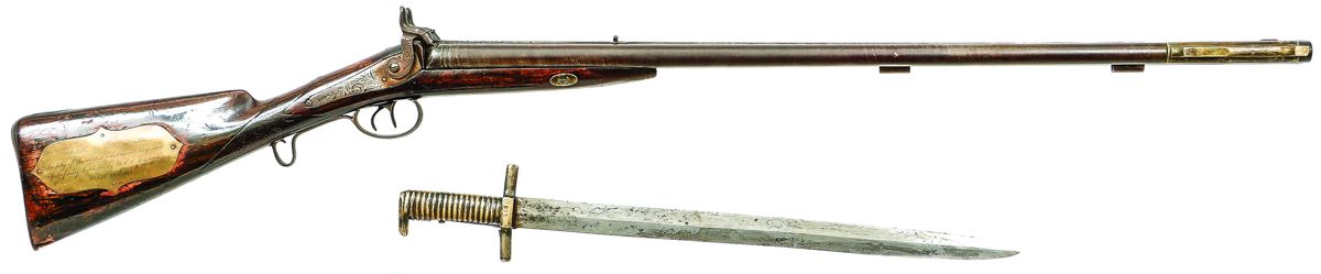 Overall view of the Chalmette Infantry cape gun altered by Cook & Brother, including a Cook & Brother saber bayonet.