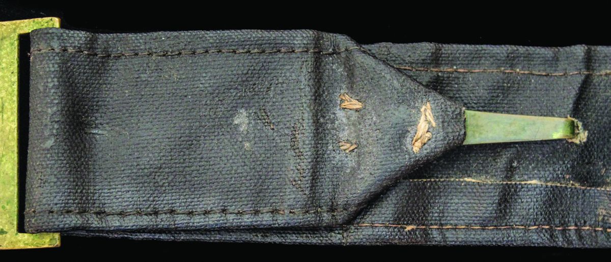 Note that the U.S. adjuster is sewn into the belt; it had been riveted onto its Federal belt.