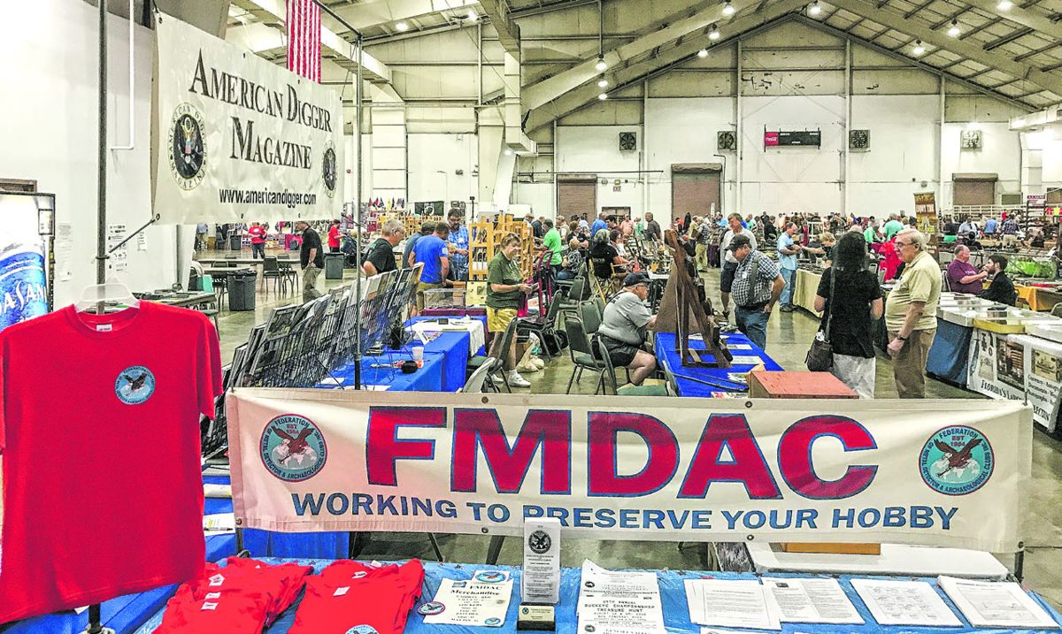 View of hall with Federation of Metal Detecting and Archeology Clubs table in foreground, along with American Digger tables.