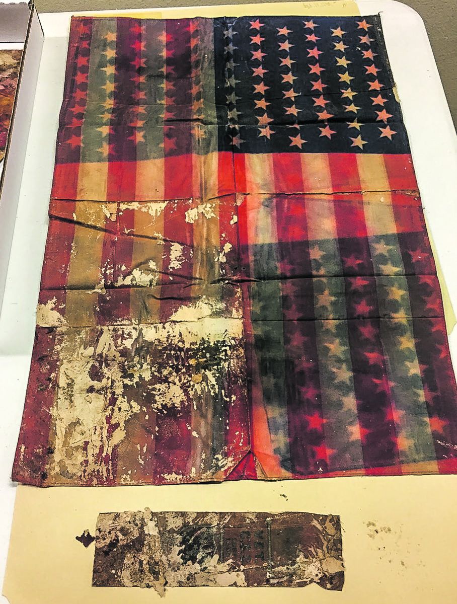 U.S. flag and ribbon.