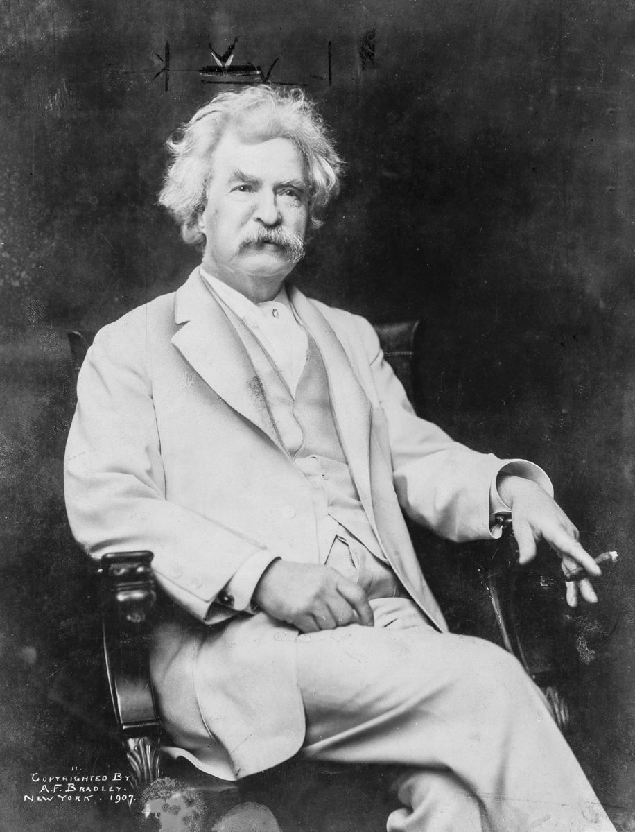 Mark Twain with cigar in hand. A.F. Bradley, New York, 1907.