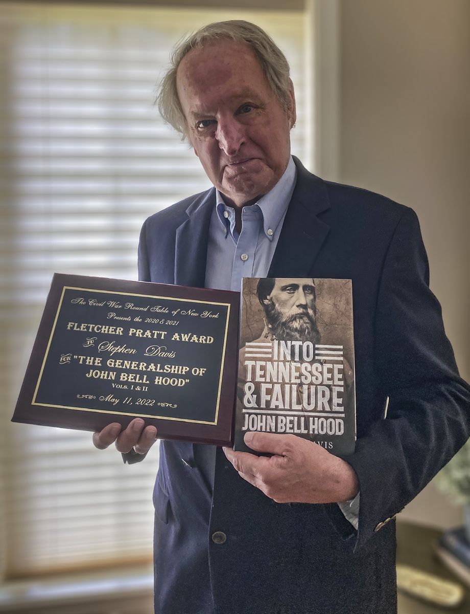 Author Stephen Davis proudly holds his Fletcher Pratt Award and his latest book, Into Tennessee & Failure John Bell Hood. (Photograph by Hunter Hawk)