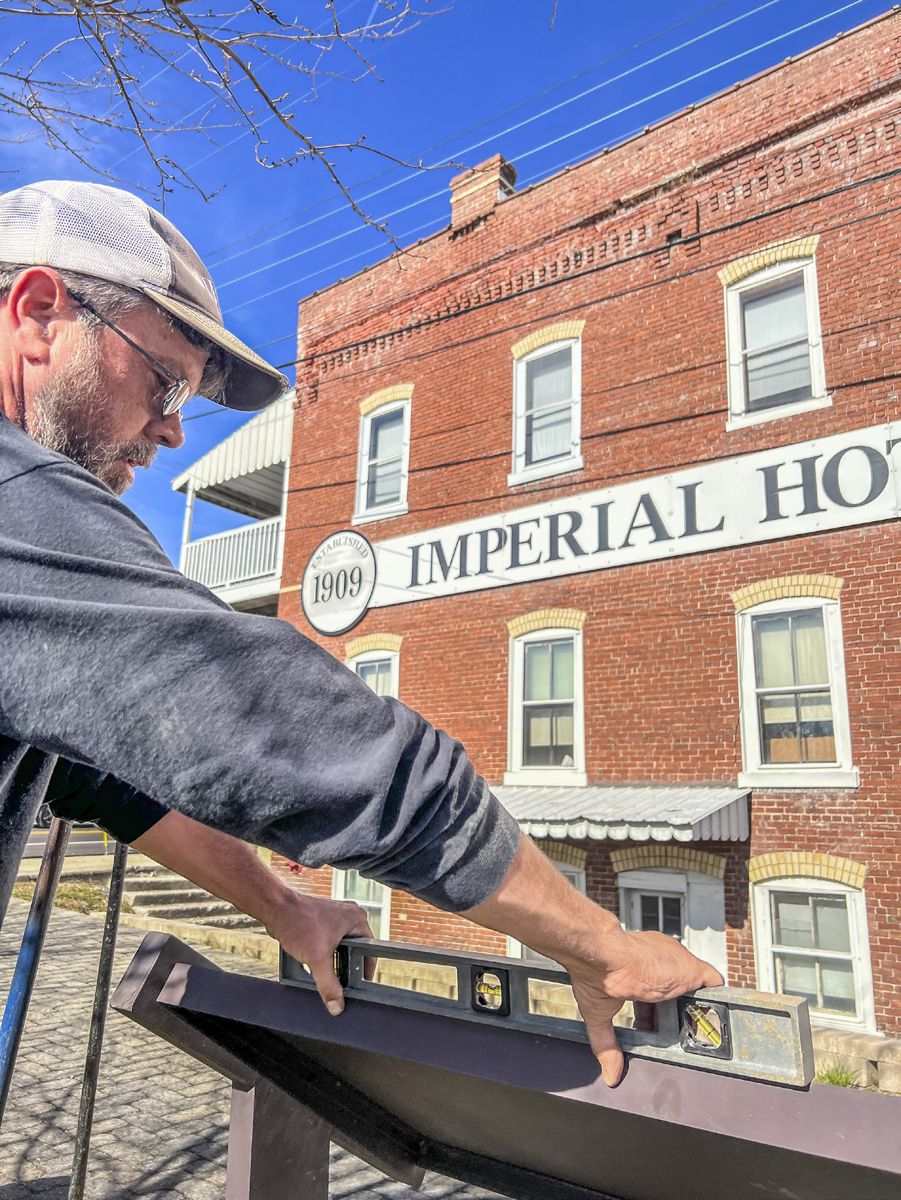 Jason Shaffer from Civil War Trails levels the new sign. The updated sign not only tells a new story but was adjusted to help improve accessibility for visitors in wheelchairs or those with visual impairments. (Courtesy, Civil War Trails, Inc.)