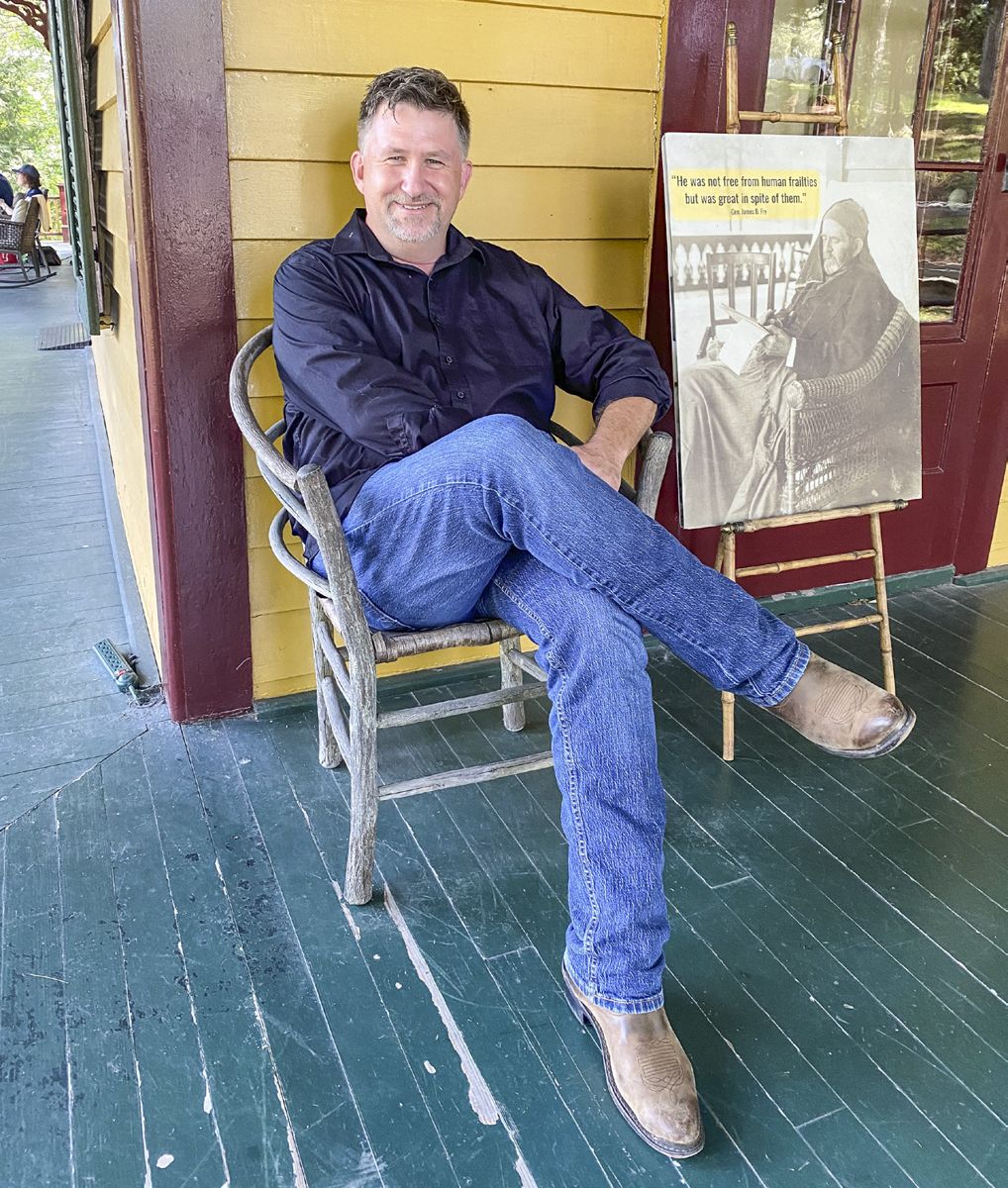 Chris Mackowski sits on the spot where US Grant worked on his memoirs during the last days of his life